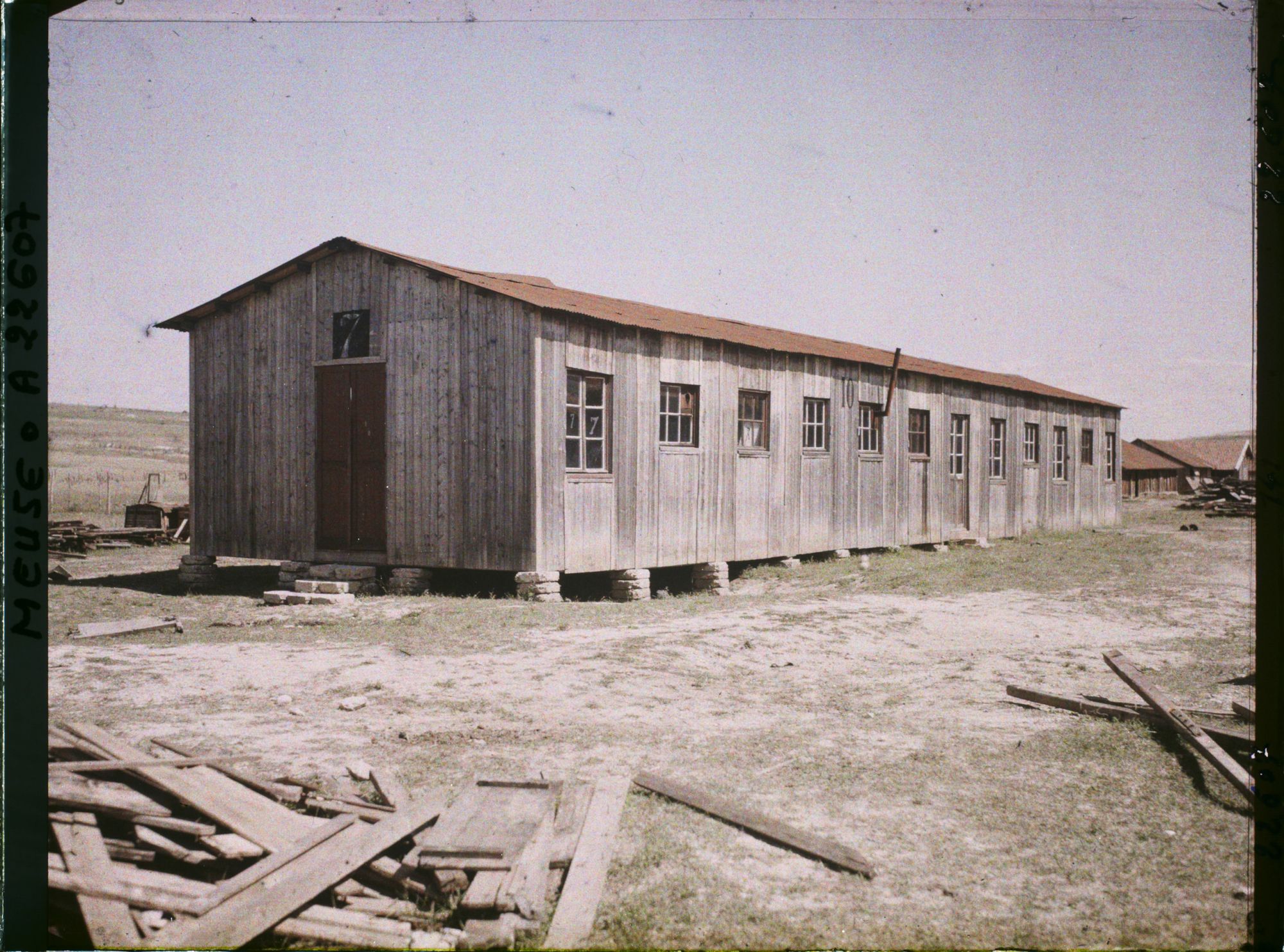 Image représentant France, Vacherauville, L'Ecole, la Mairie et l'Eglise dans la même maison de bois