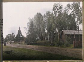 Image représentant Auguste Léon photographiant une scène de la vie rurale