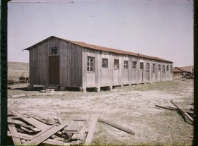 Image représentant France, Vacherauville, L'Ecole, la Mairie et l'Eglise dans la même maison de bois